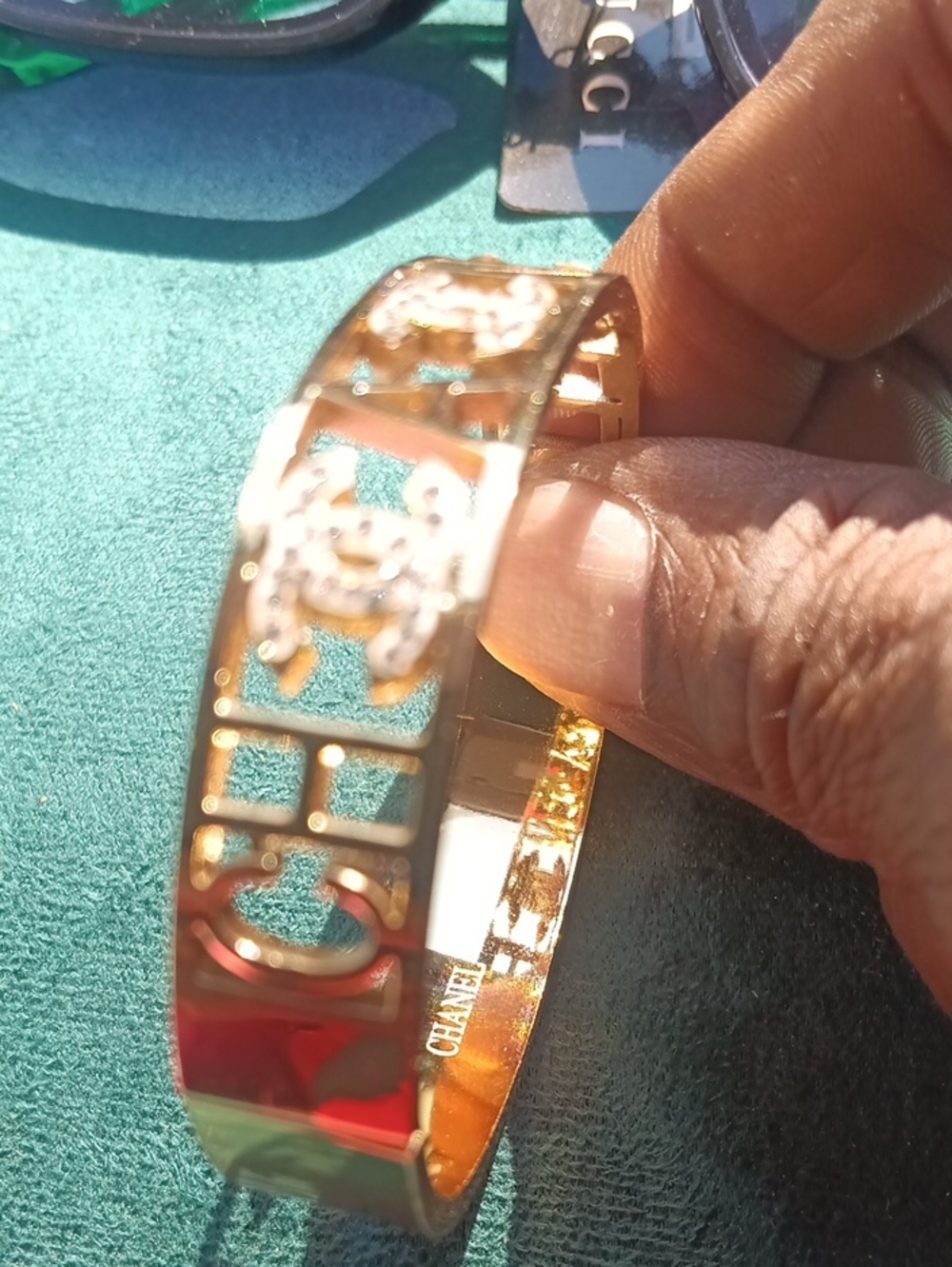 CHANEL Gold Cut-Out Logo Bangle